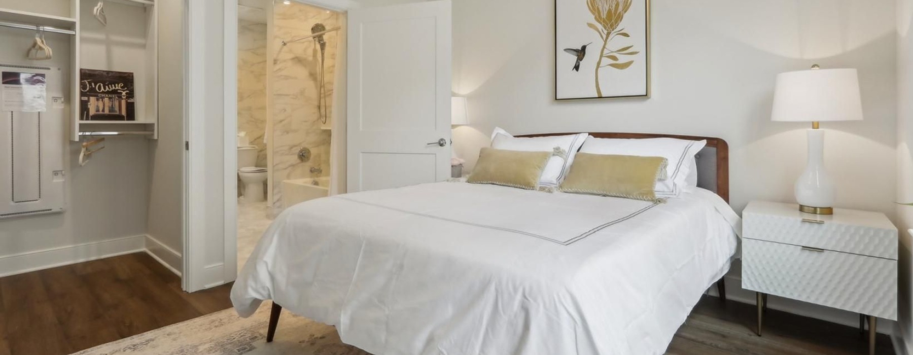 a bedroom with a bed and a lamp