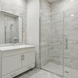 a spacious bathroom with a walk-in shower