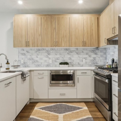 a kitchen with white cabinets
